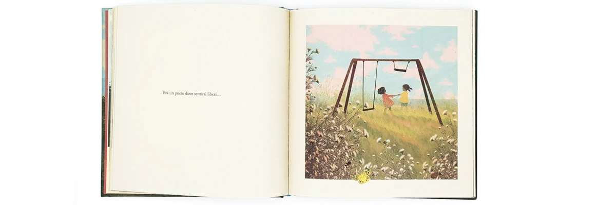 Pagina interna del libro, con due bimbe sotto l'altalena e la scritta "Era un posto dove sentirsi liberi". Il libro è delicato, ma profondo